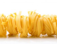 row dry nest pasta on white with reflection row dry nest pasta on white with reflection